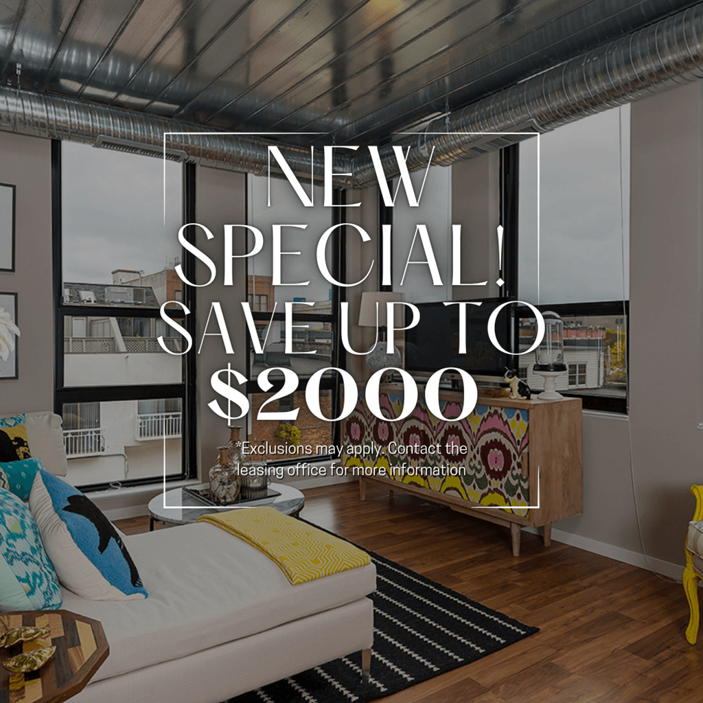 A modern living room with a large window and a view of the city, advertising a new special offer to save up to $2000.